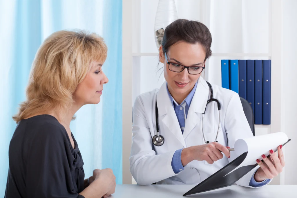 A doctor explains something to her patient