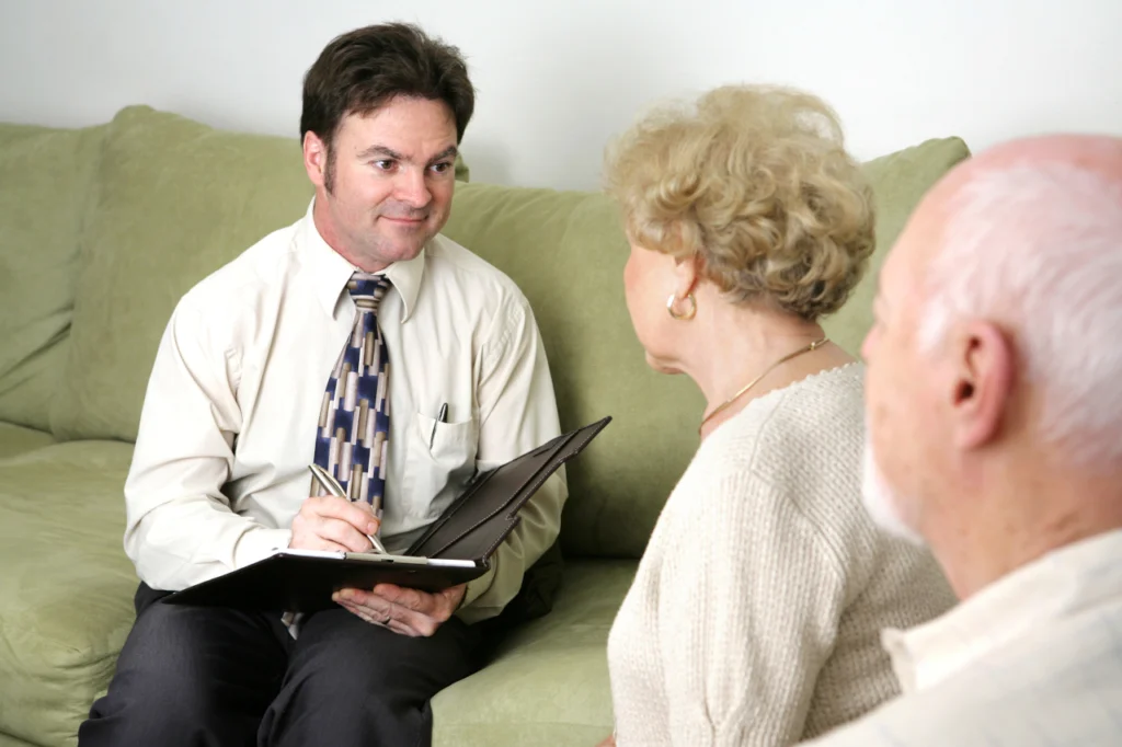 A therapist speaks with a couple during a psychoanalytic therapy session