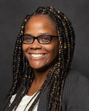 Dr. Naharia Heard