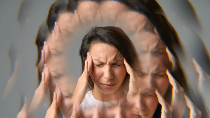 Depiction of a woman suffering from stress or burnout. Learn more about therapy for burnout here.