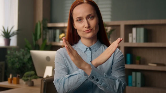 A woman crosses her arms, signifying rejection. Learn about Rejection Sensitive Dysphoria (RSD) and ADHD here.